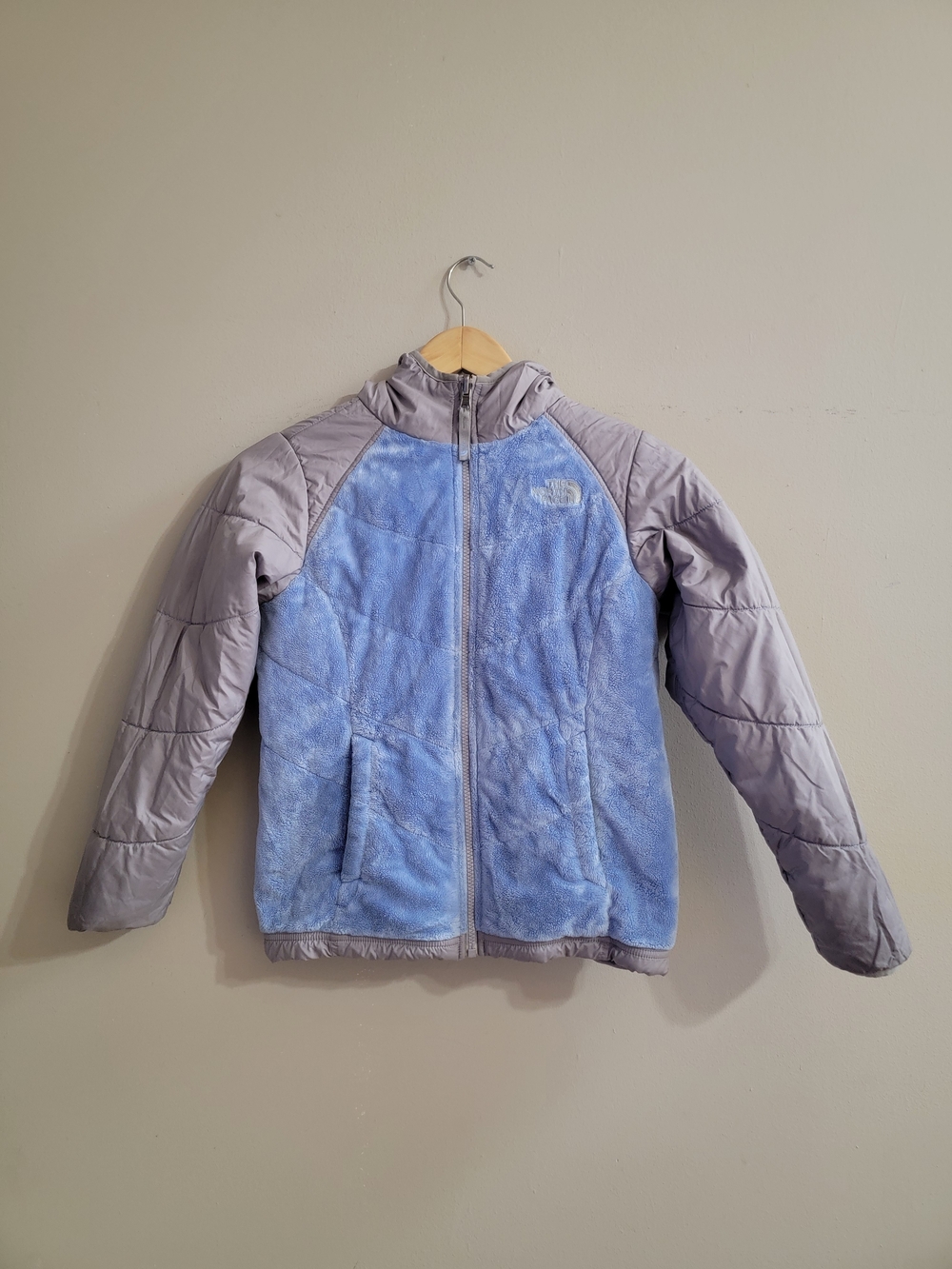 The North Face Revercible Light Blue Fleece Jacket with Gray Quilted Sleeves